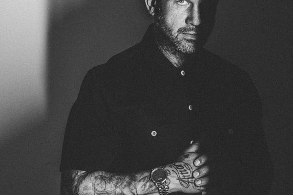 a model portfolio of a tattooed barber